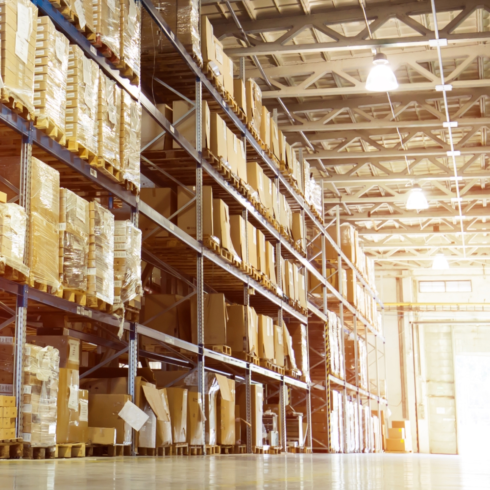 Large warehouse with shelves of stacked boxes