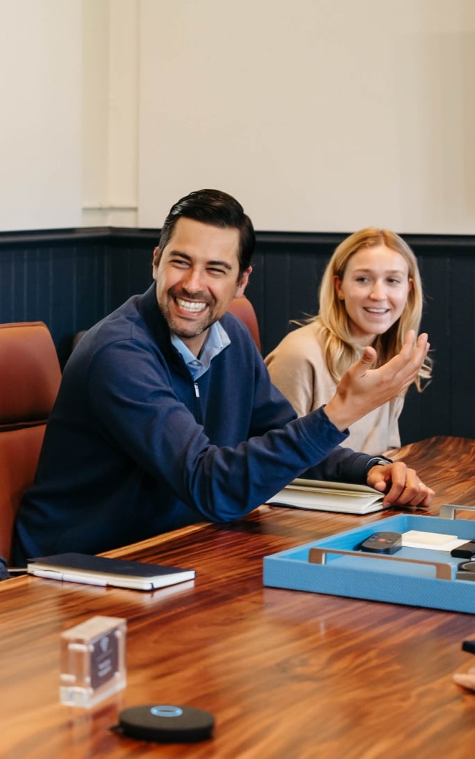 Smiling colleagues having a discussion in office